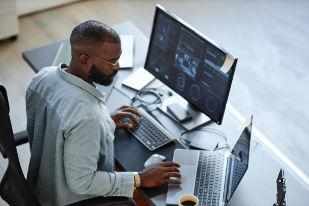 Professional working with AI tools at desk